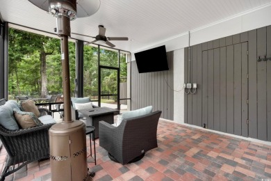 Nestled on a serene 1.88 acre wooded lot, enjoy resort-style