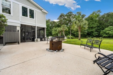 Nestled on a serene 1.88 acre wooded lot, enjoy resort-style