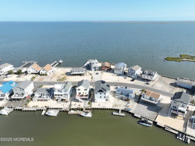 Wake to soft morning light dancing across the bay and end each