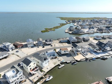 Wake to soft morning light dancing across the bay and end each