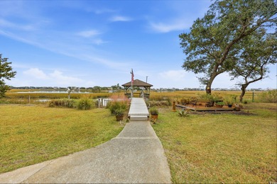 Set on a generous .44-acre homesite and positioned along one of