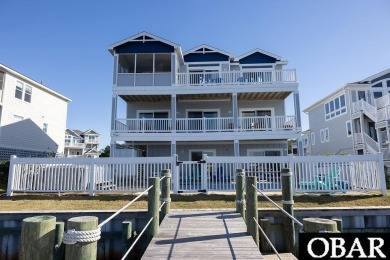 Nestled in the serene Corolla Bay community, 1024 Cruz Bay Lane