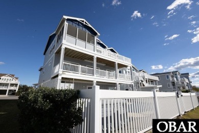 Nestled in the serene Corolla Bay community, 1024 Cruz Bay Lane