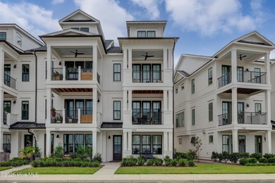 This luxurious townhome in Riverlights Marina Village was built