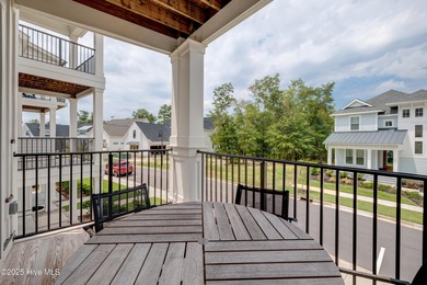 This luxurious townhome in Riverlights Marina Village was built