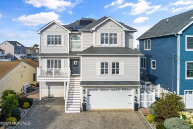 This meticulous waterfront stunner will take your breath away!