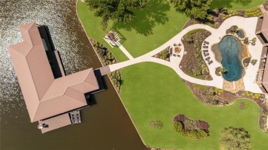 Welcome to the pinnacle of luxury lakefront living on nearly 2