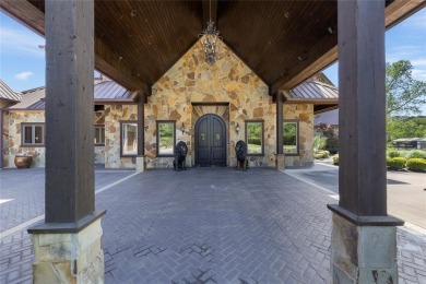 Welcome to the pinnacle of luxury lakefront living on nearly 2