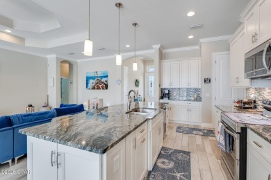 Nestled within the gated Dolphin Bay community, 906 Dolphin