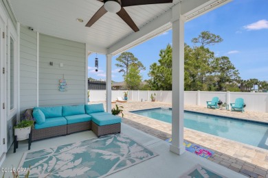 Nestled within the gated Dolphin Bay community, 906 Dolphin