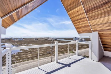 Welcome to your Beach House, a stunning example of contemporary