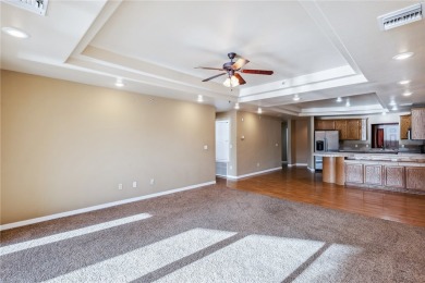 Experience riverfront living at its finest in this spacious