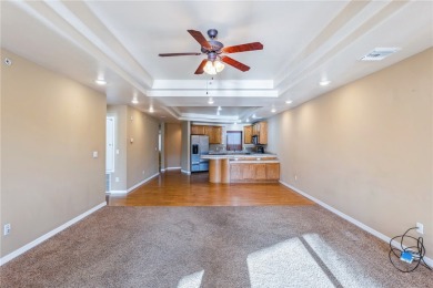 Experience riverfront living at its finest in this spacious