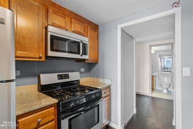 Wake up to sweeping views of the Detroit River and downtown