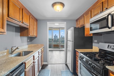 Wake up to sweeping views of the Detroit River and downtown