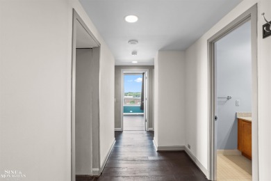 Wake up to sweeping views of the Detroit River and downtown