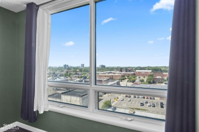 Wake up to sweeping views of the Detroit River and downtown