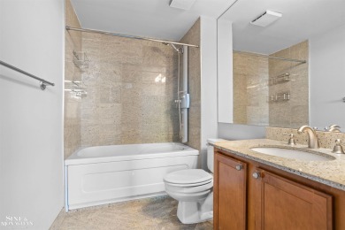 Wake up to sweeping views of the Detroit River and downtown