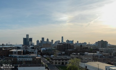 Wake up to sweeping views of the Detroit River and downtown