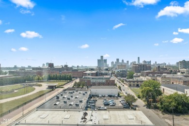 Wake up to sweeping views of the Detroit River and downtown