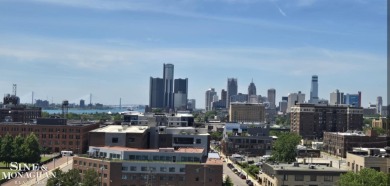 Wake up to sweeping views of the Detroit River and downtown