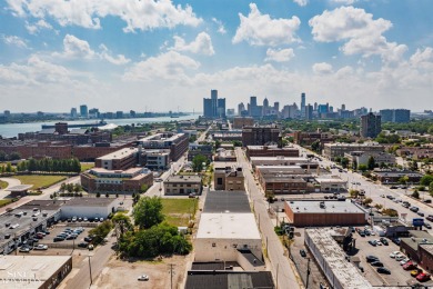 Wake up to sweeping views of the Detroit River and downtown