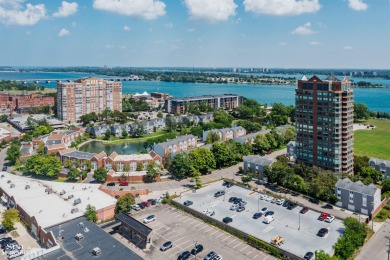 Wake up to sweeping views of the Detroit River and downtown