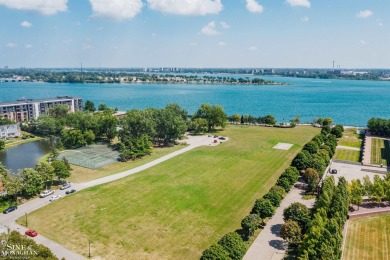 Wake up to sweeping views of the Detroit River and downtown