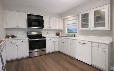 Beautifully refreshed brick home on 1 full acre just off US Hwy