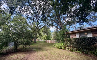 Beautifully refreshed brick home on 1 full acre just off US Hwy