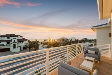 Overlooking the pristine sands of Fort Myers Beach, this BRAND