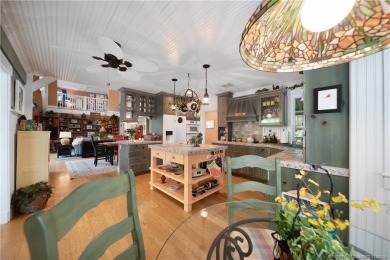 Attention car collectors!!! This unique lushly landscaped 3