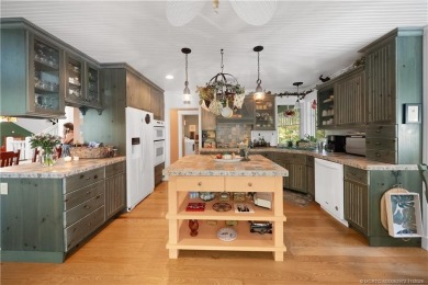 Attention car collectors!!! This unique lushly landscaped 3