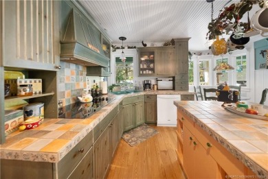 Attention car collectors!!! This unique lushly landscaped 3