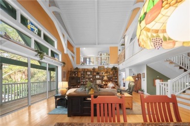 Attention car collectors!!! This unique lushly landscaped 3