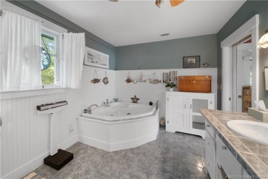 Attention car collectors!!! This unique lushly landscaped 3