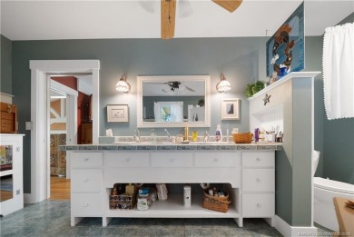 Attention car collectors!!! This unique lushly landscaped 3