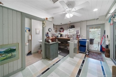 Attention car collectors!!! This unique lushly landscaped 3