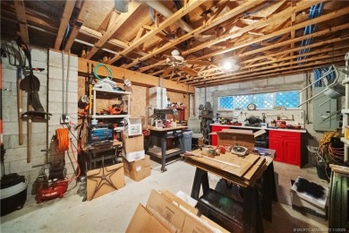 Attention car collectors!!! This unique lushly landscaped 3