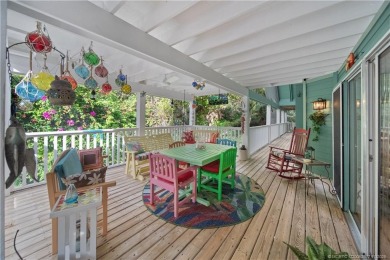 Attention car collectors!!! This unique lushly landscaped 3