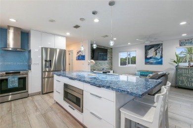 Luxurious contemporary home in Paradise. This 4 bedroom 4 1/2