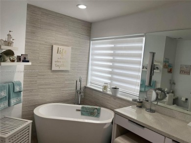 Luxurious contemporary home in Paradise. This 4 bedroom 4 1/2