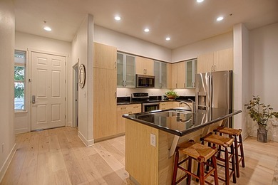 Downtown living at its best with this luxurious, high ceiling