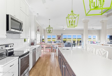 Enjoy coastal living at its finest on Figure Eight, an exclusive