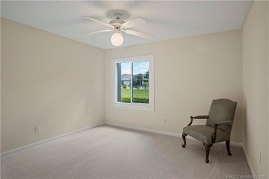 Enjoy the ease of Florida living in this first floor, end unit