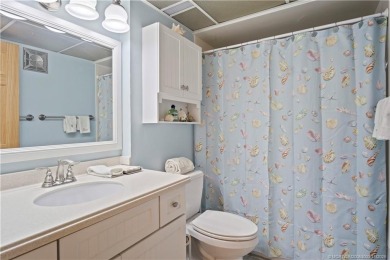 Enjoy the ease of Florida living in this first floor, end unit