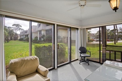 Enjoy the ease of Florida living in this first floor, end unit