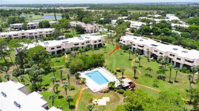 Enjoy the ease of Florida living in this first floor, end unit