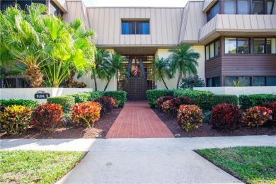 Enjoy the ease of Florida living in this first floor, end unit