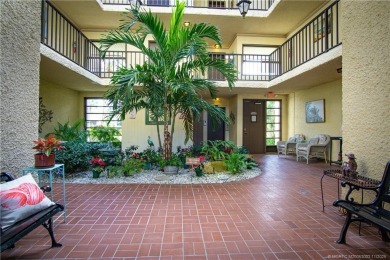 Enjoy the ease of Florida living in this first floor, end unit
